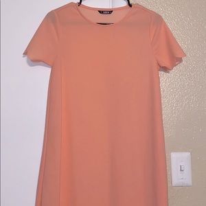 Pink t-shirt dress with scallop detailing on edges